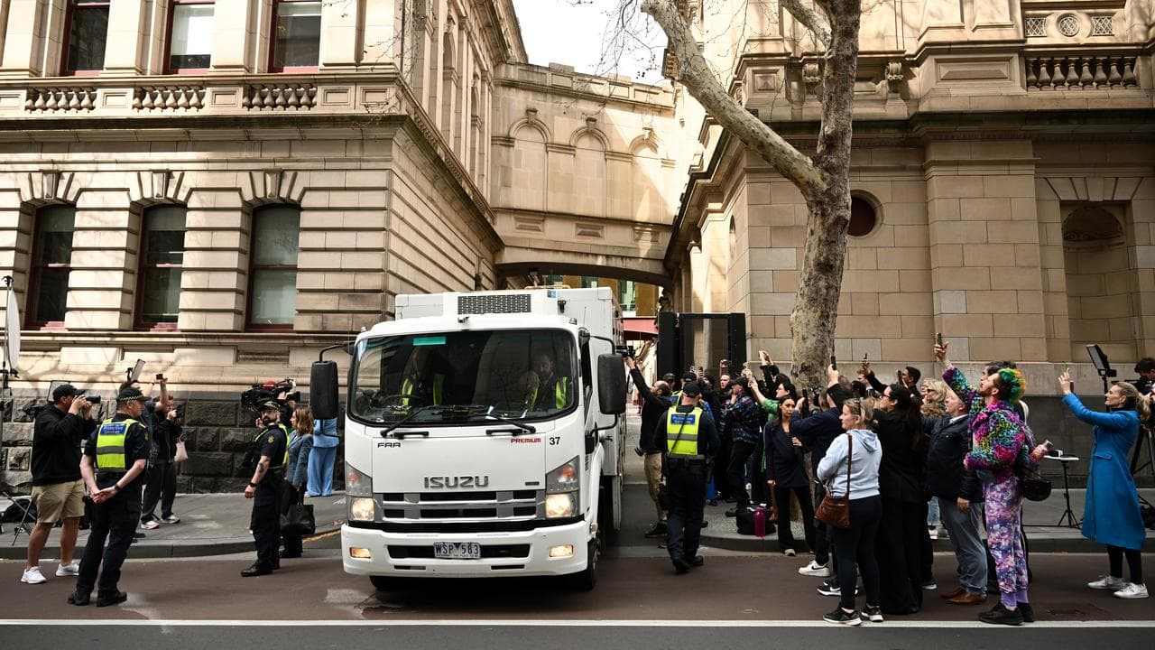 A prison van carrying Erin Patterson leaves the Supreme Court
