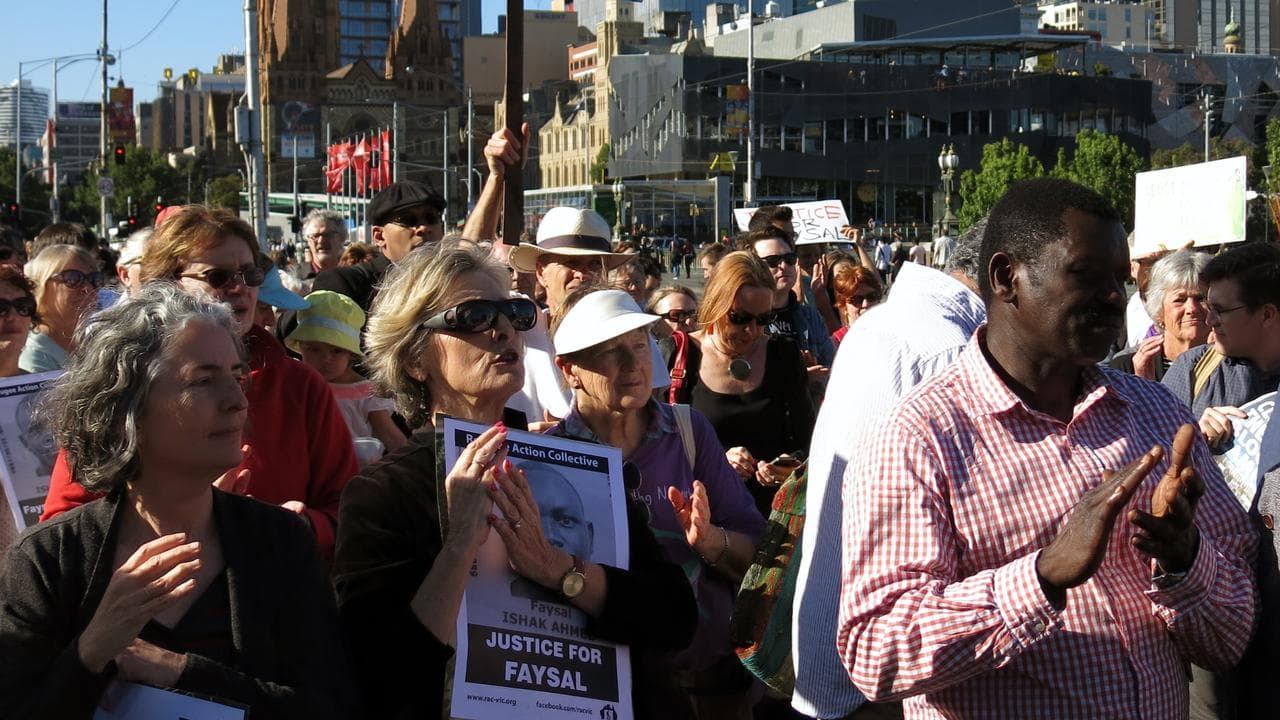 Refugee advocates hold a vigil for Faysal Ishak Ahmed