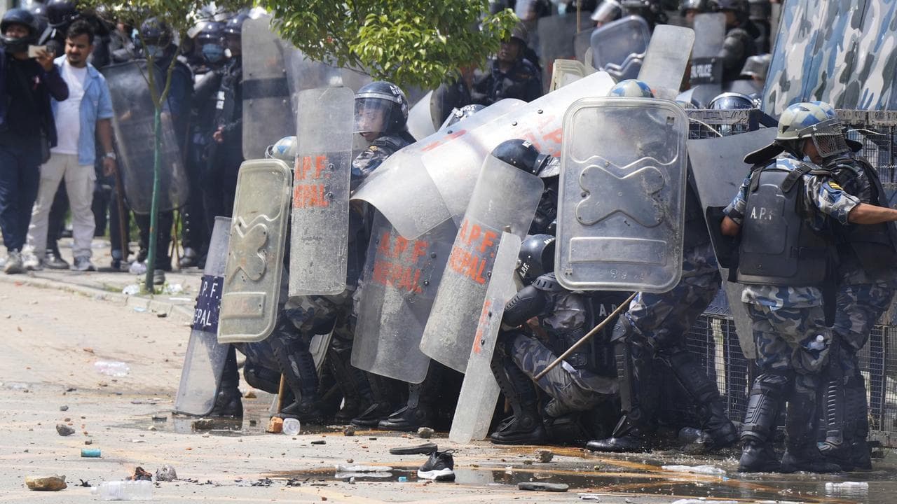 Riot police clash with protesters in Kathmandu, Nepal