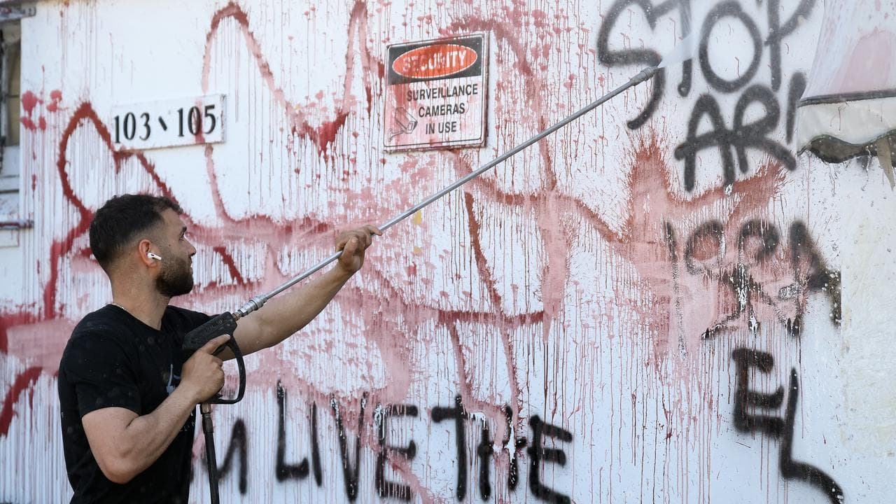 Graffiti being cleaned of the wall at SEC Plating
