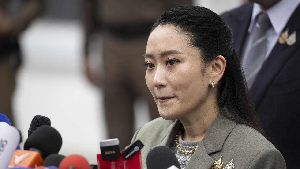 Former prime minister Paetongtarn Shinawatra speaks to reporters