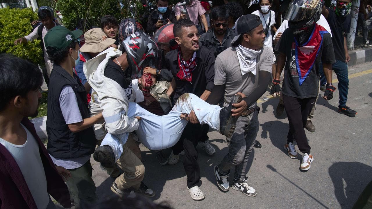 Injured protester is taken to hospital during protests n Kathmandu
