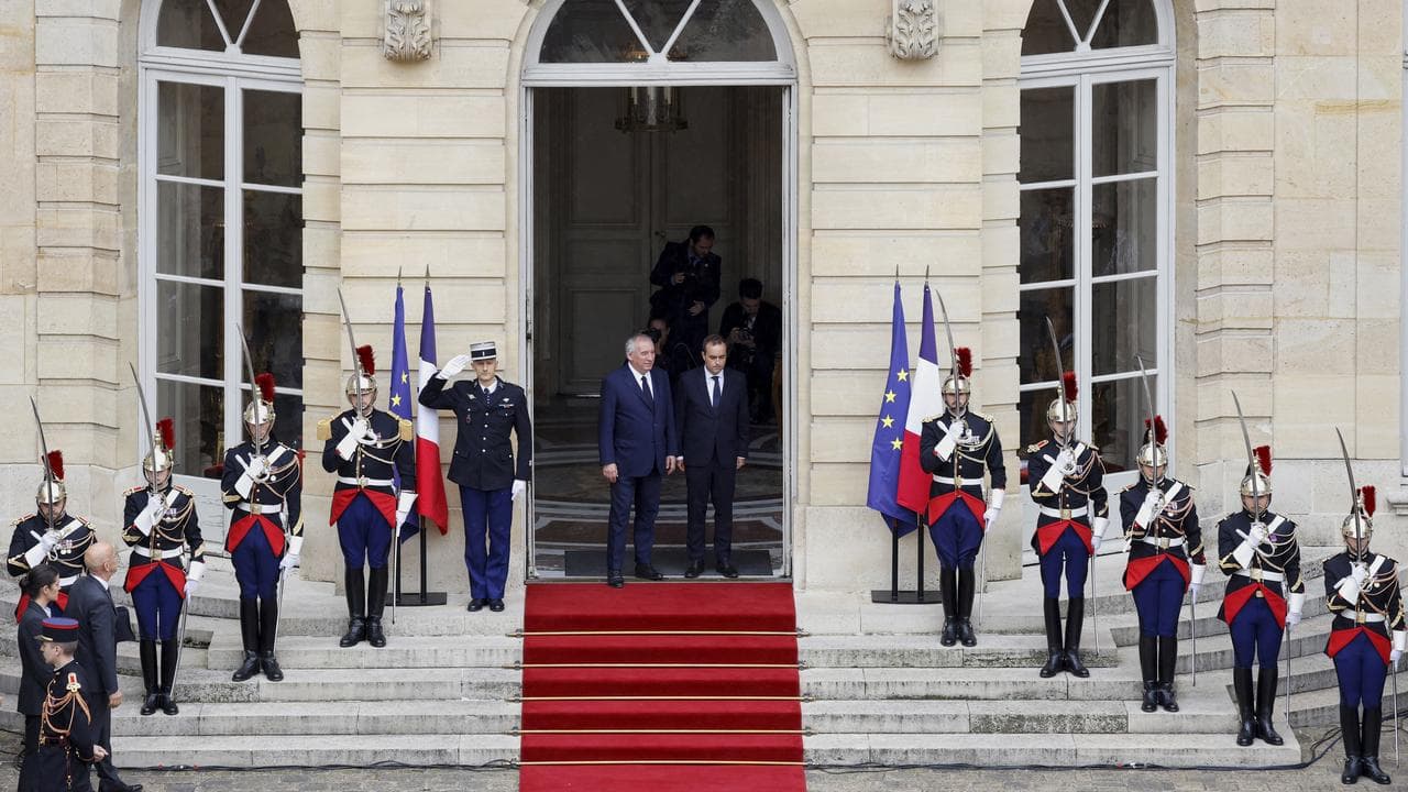 Francois Bayrou and Sebastien Lecornu at a handover ceremony in Paris