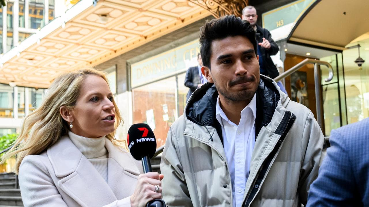 Ulises Davila (right) departs Downing Centre