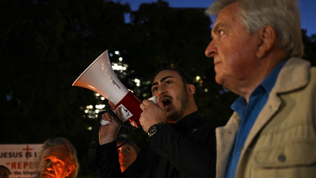 Joel Jammal of Turning Point Australia speaks at a vigil in Sydney
