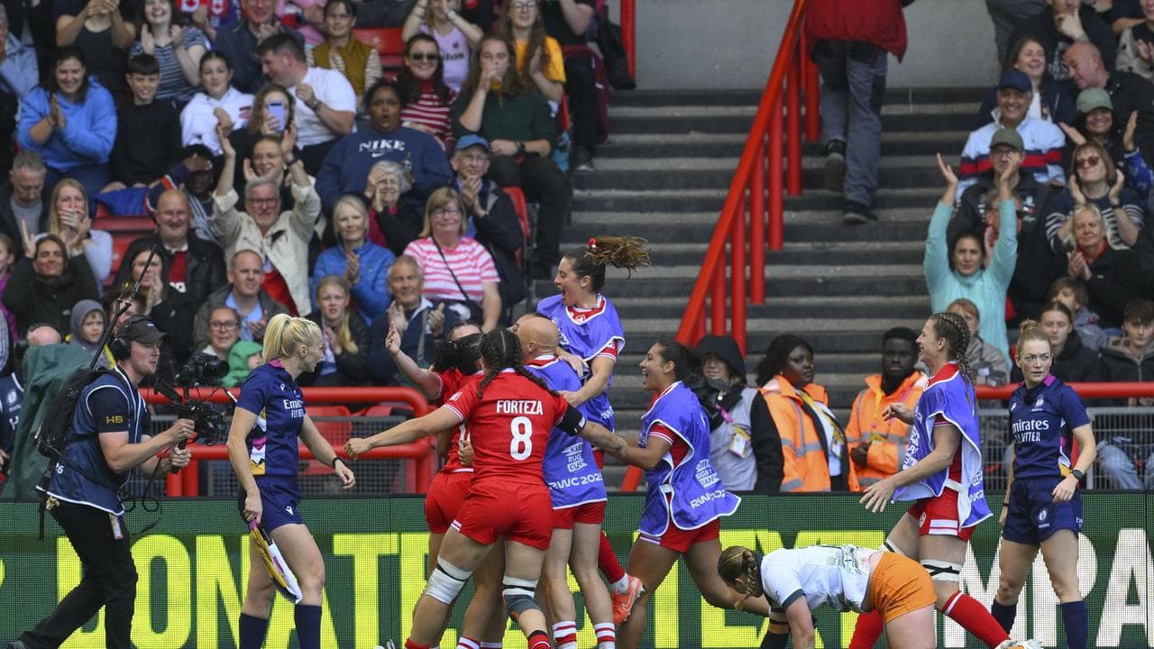 Caanda's players celebrate against Australia.