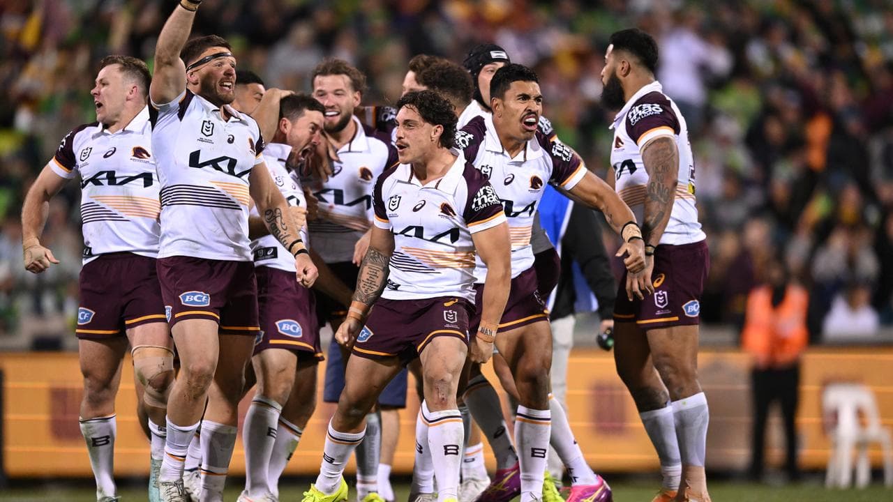 The Broncos celebrate their victory over the Raiders