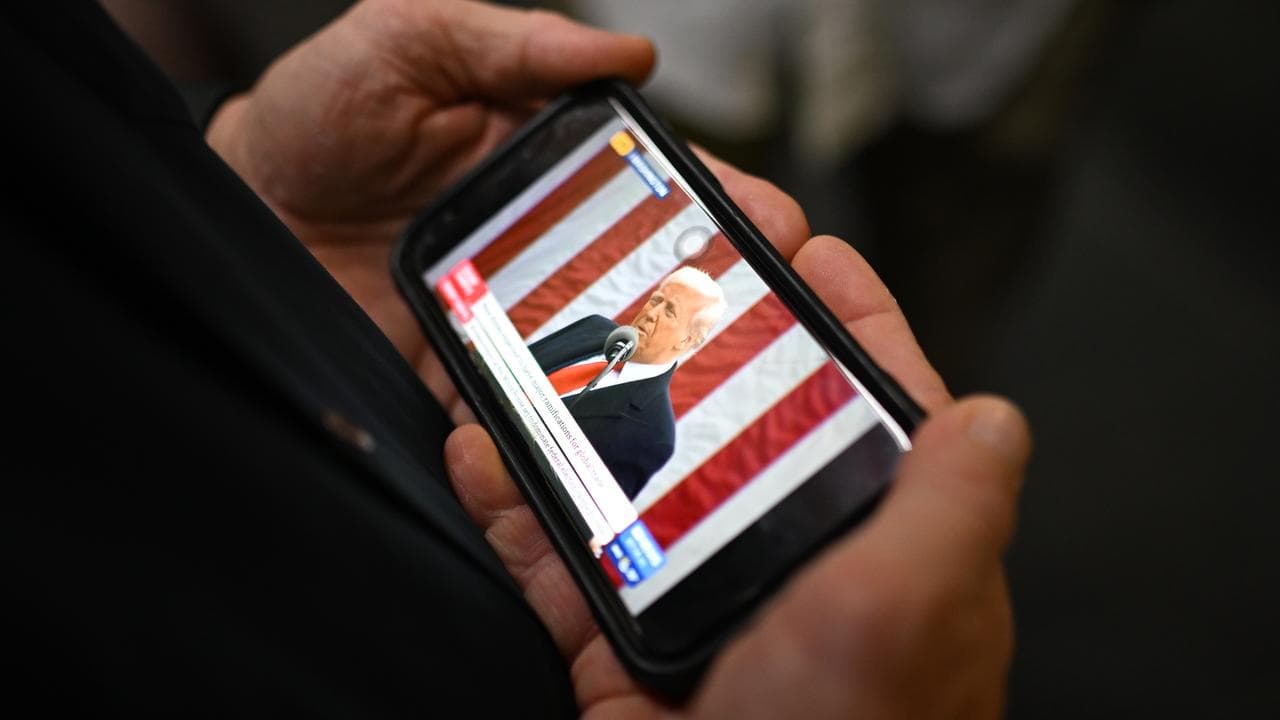 Someone watching Donald Trump on a phone