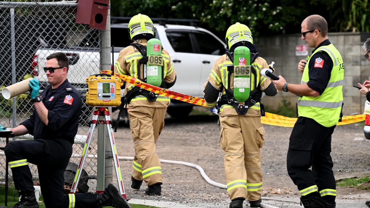 NSW Fire and Rescue personnel in breathing apparatus at the scene