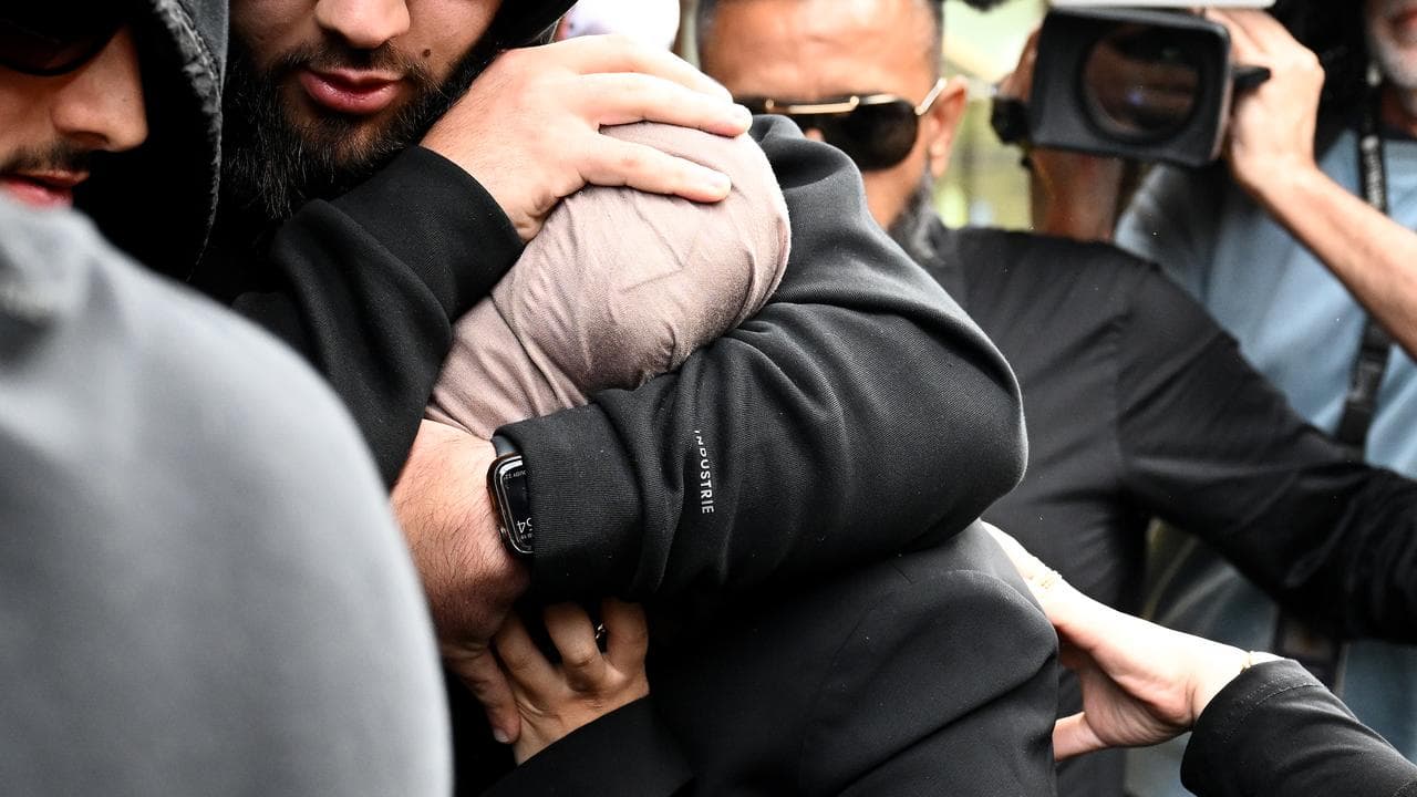 Sarah Abu Lebdeh (centre, file)