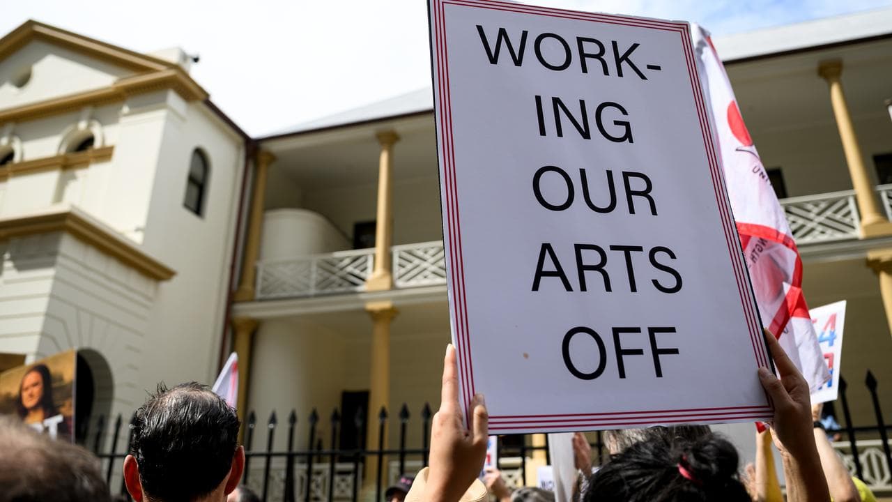 Art Gallery Of NSW (AGNSW) staff hold placards