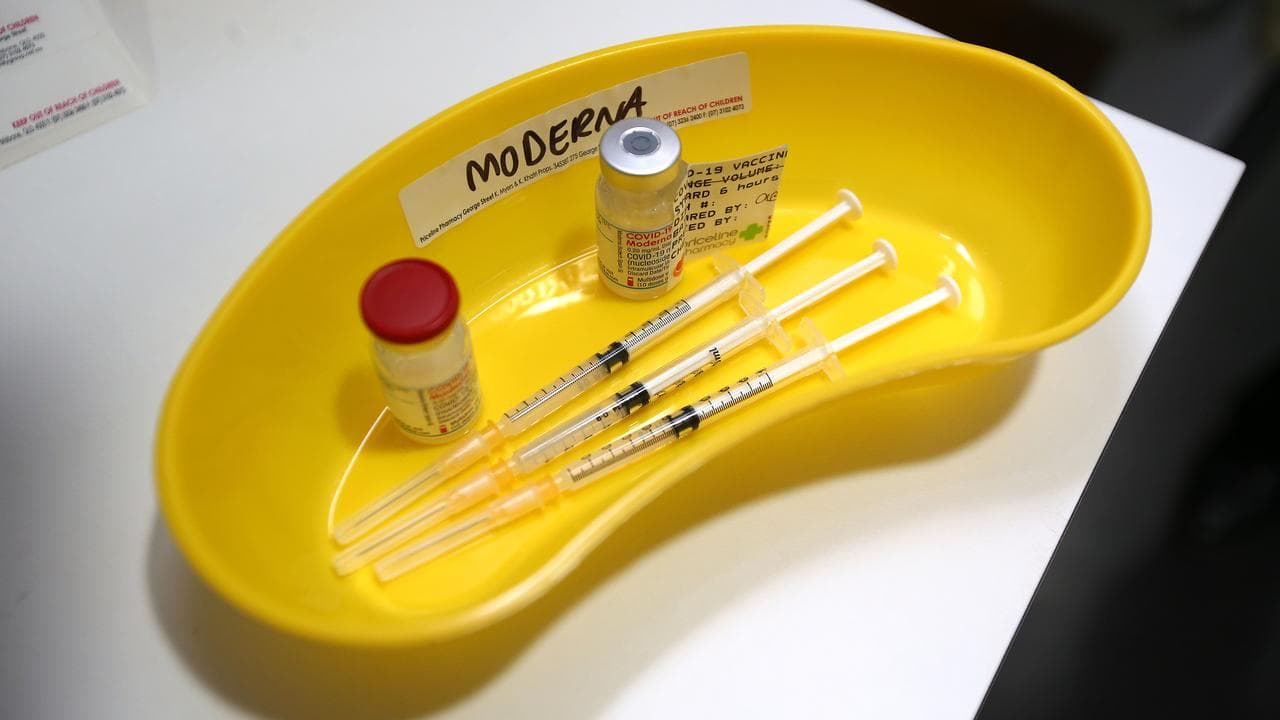 Moderna COVID-19 vaccine and needles