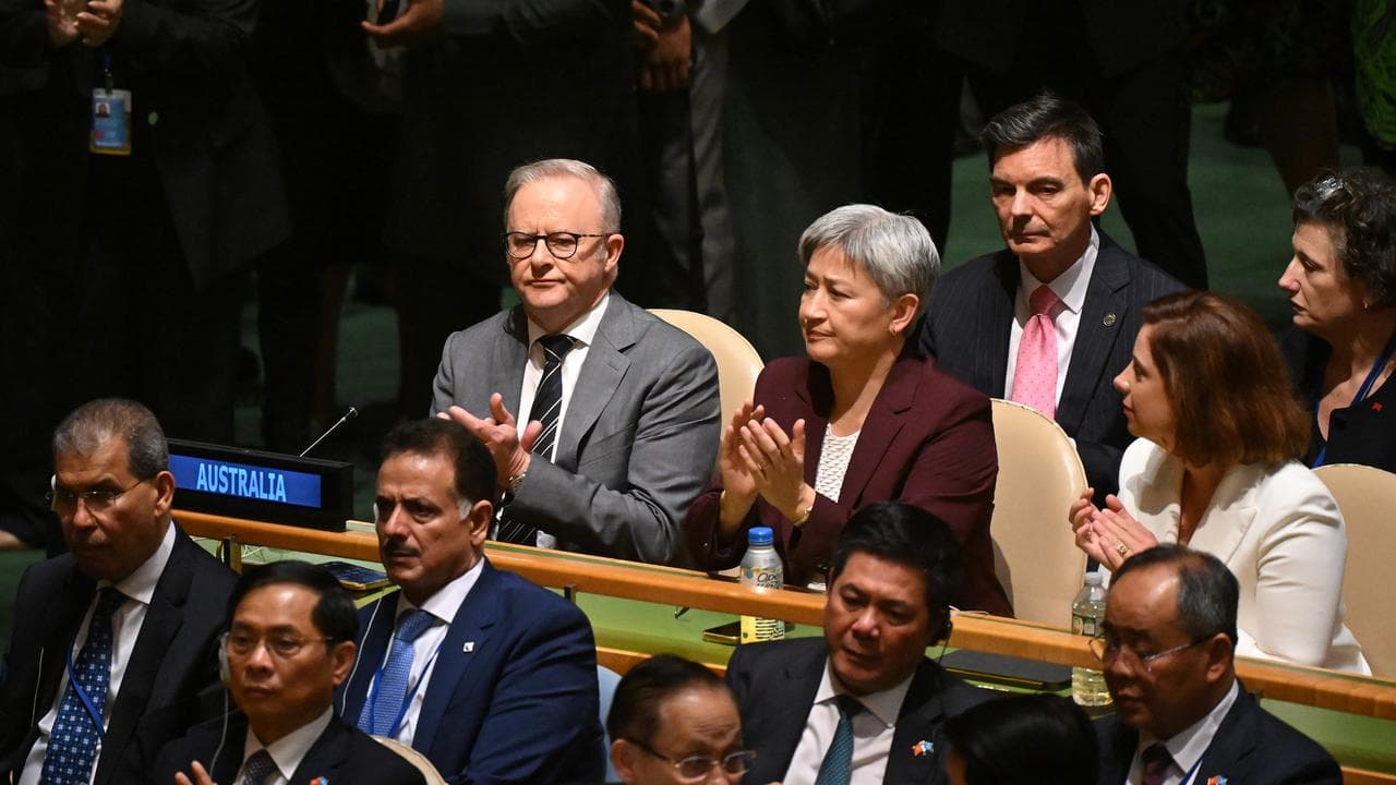 The PM, Penny Wong and Communications Minister Anika Wells