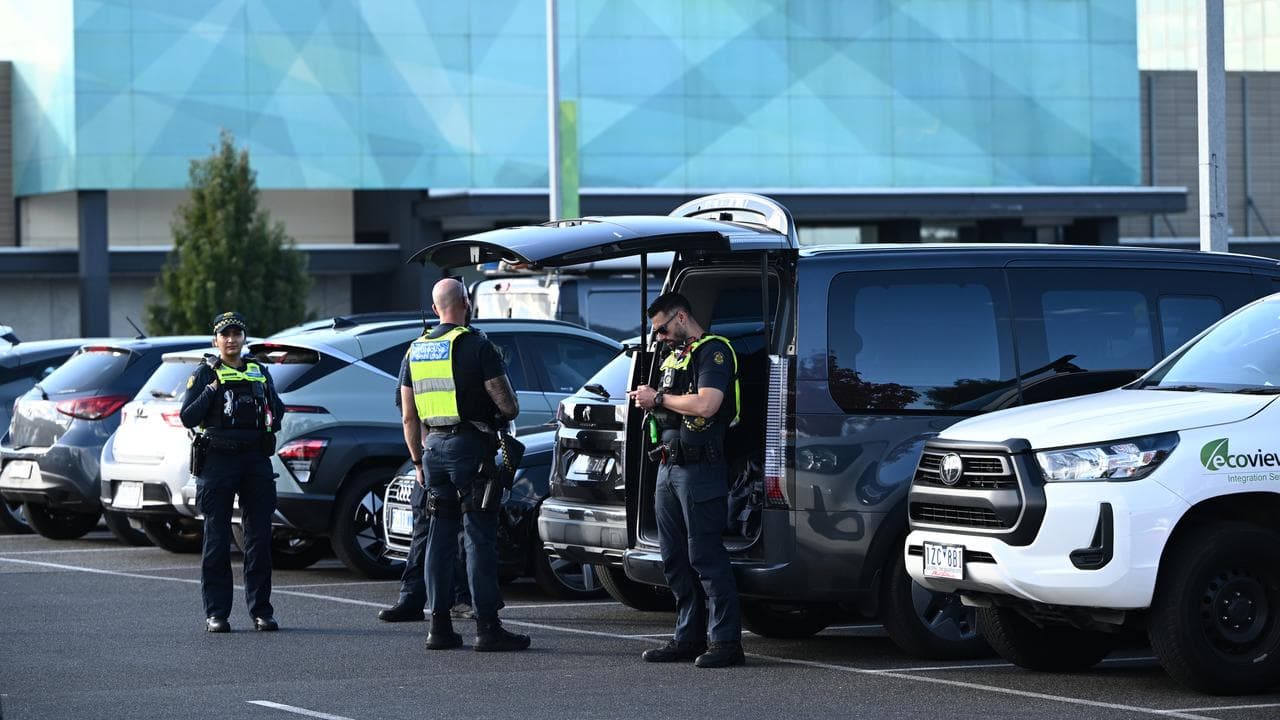 A Victoria police car and signage at Northland Shopping Centre