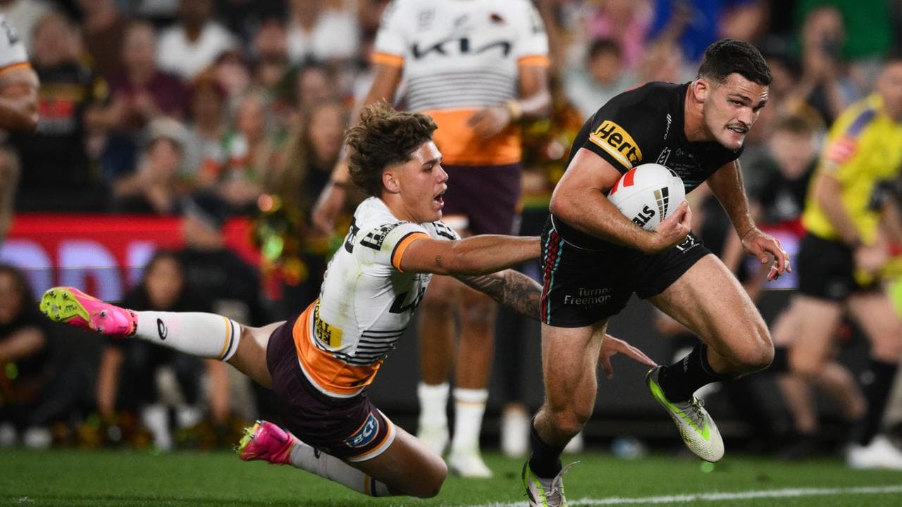 Nathan Cleary runs past Reece Walsh to score the winning try.