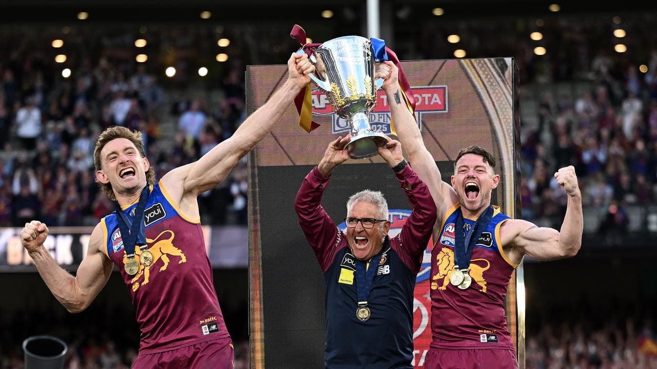 Harris Andrews, coach Chris Fagan and Lachie Neale.