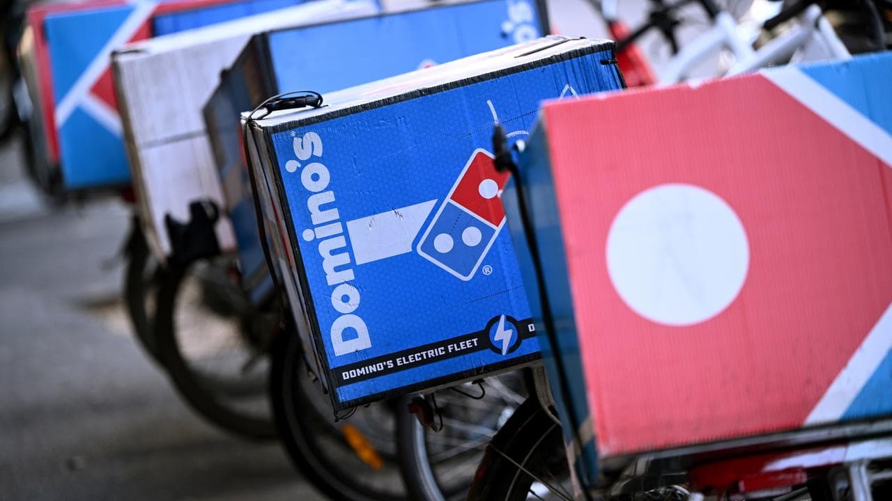 Delivery bikes outside a Domino's Pizza store (file image)
