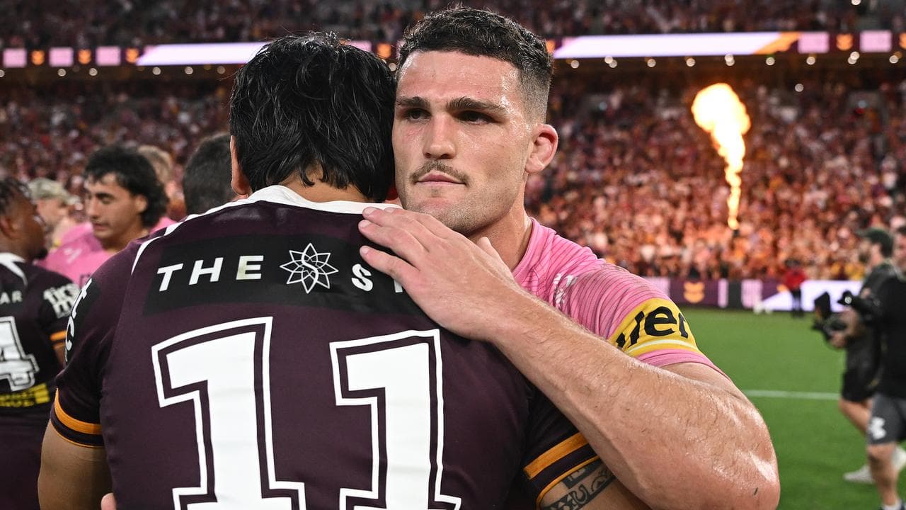 Brendan Piakura (left) embraces Nathan Cleary.
