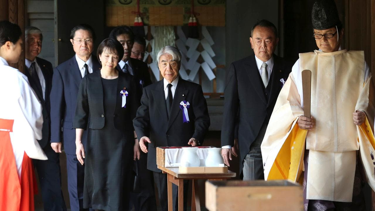MPs including Sanae Takaichi, centre left, visit the Yasukuni Shrine