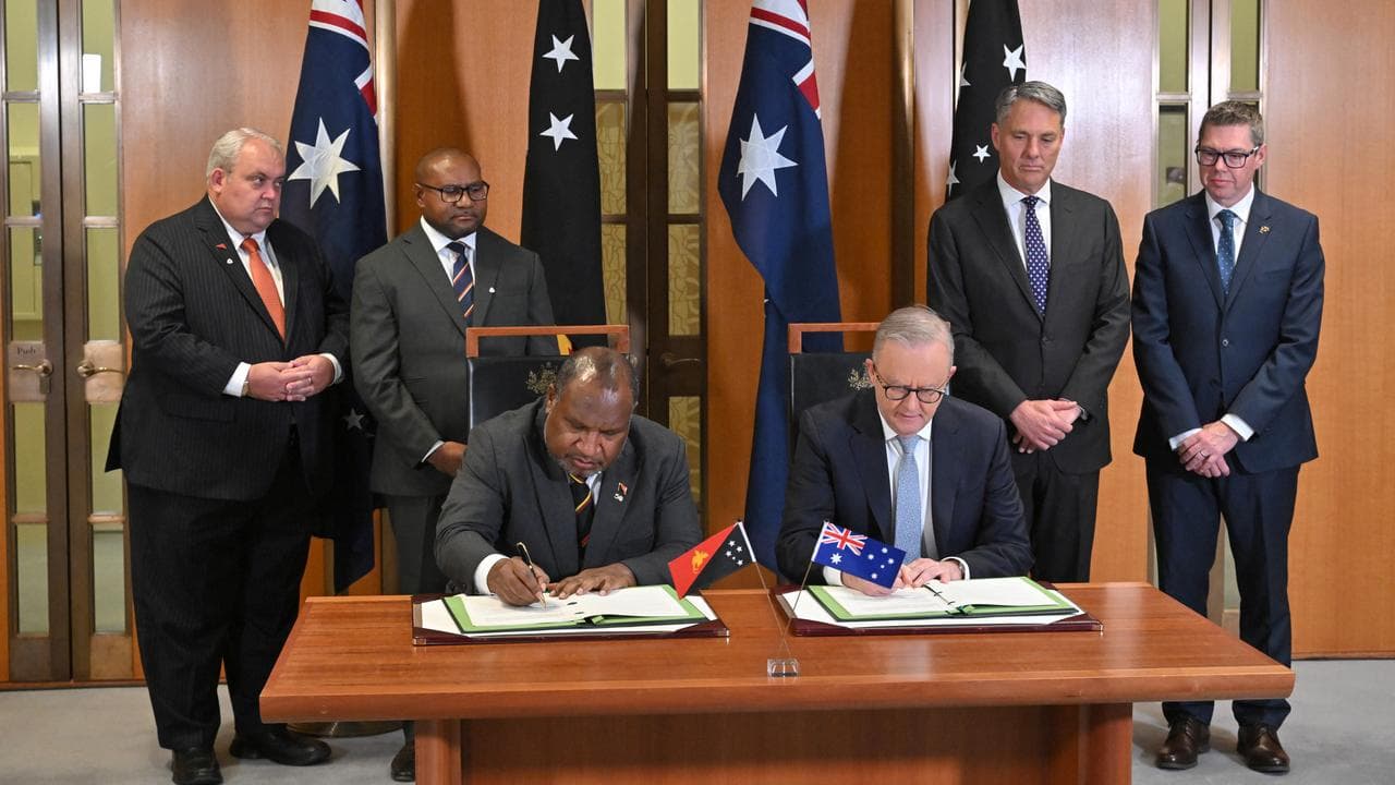 James Marape and Anthony Albanese sign the treaty