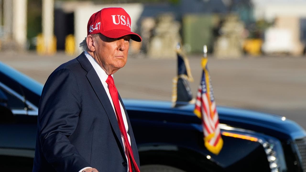 President Donald Trump walks to board Air Force One