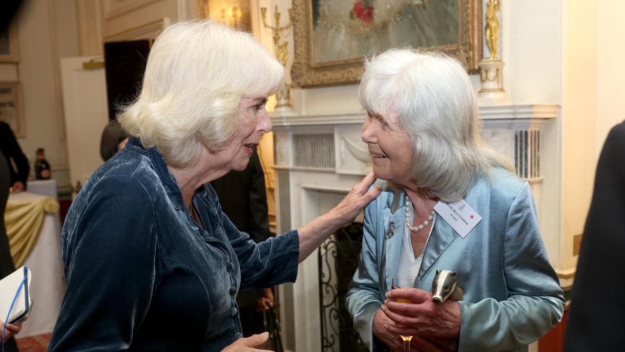 Queen Camilla speaks with Jilly Cooper during a reception
