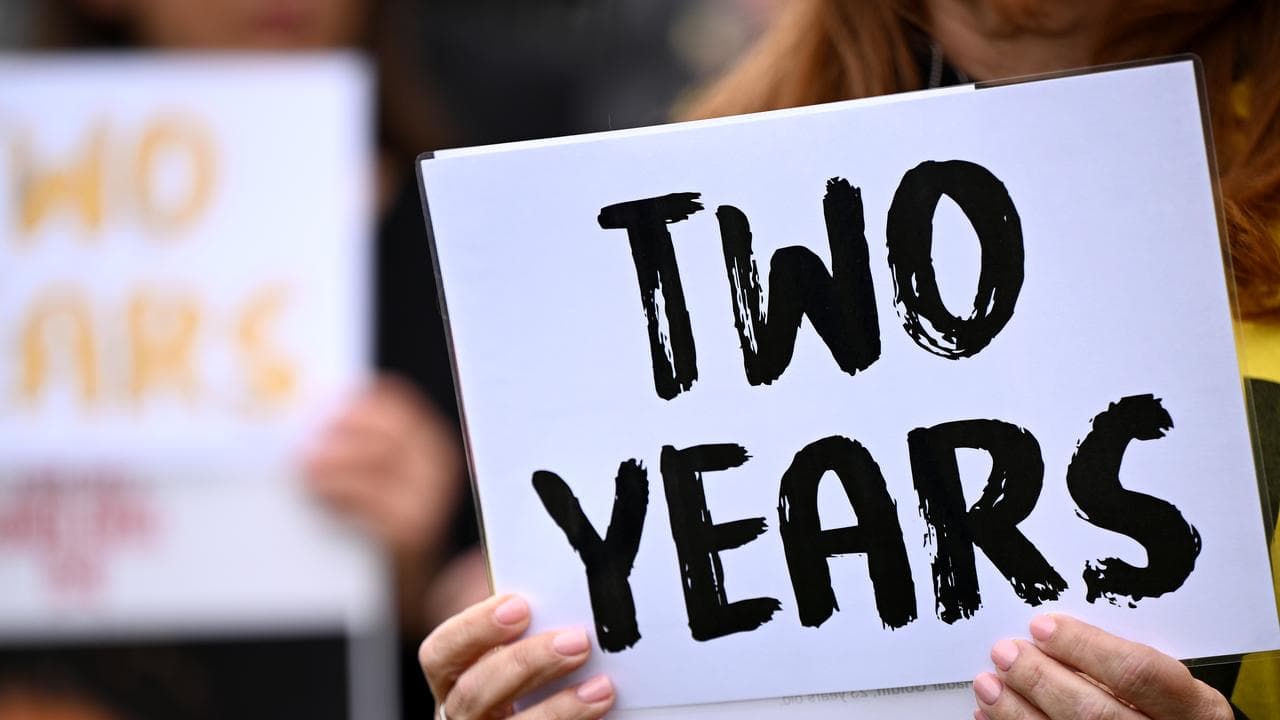 Protesters hold placards for Israeli hostages