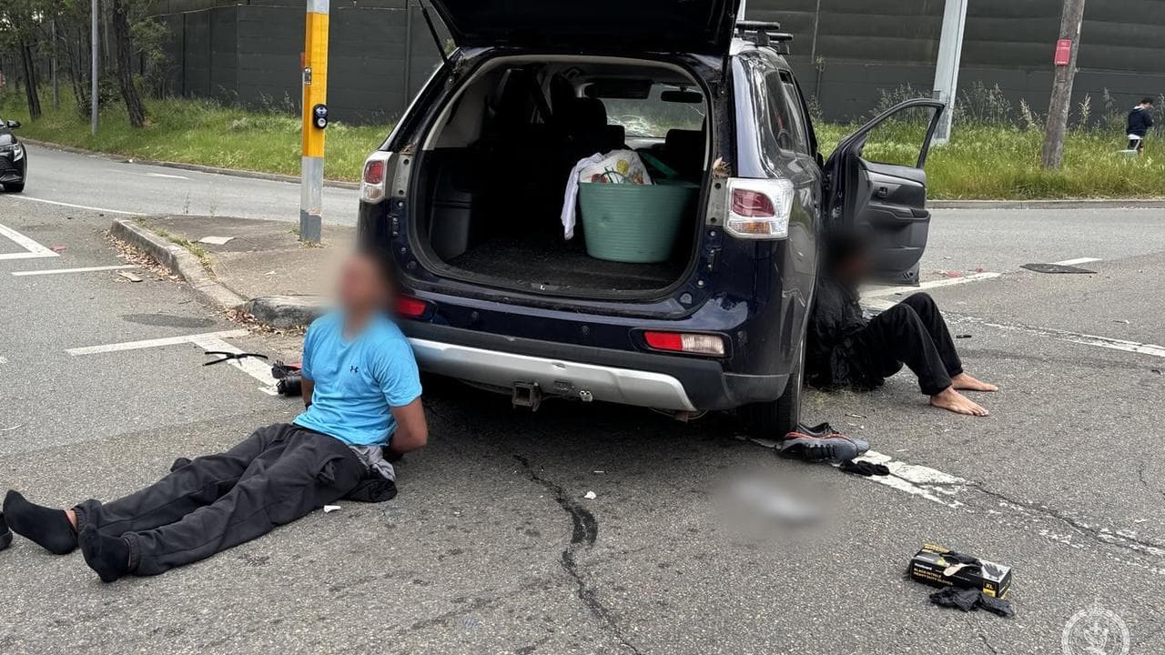 Two of the men being arrested