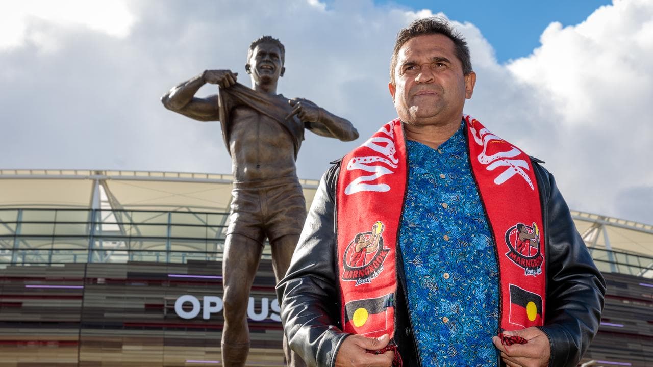 Nicky Winmar in front of his statue (file image)