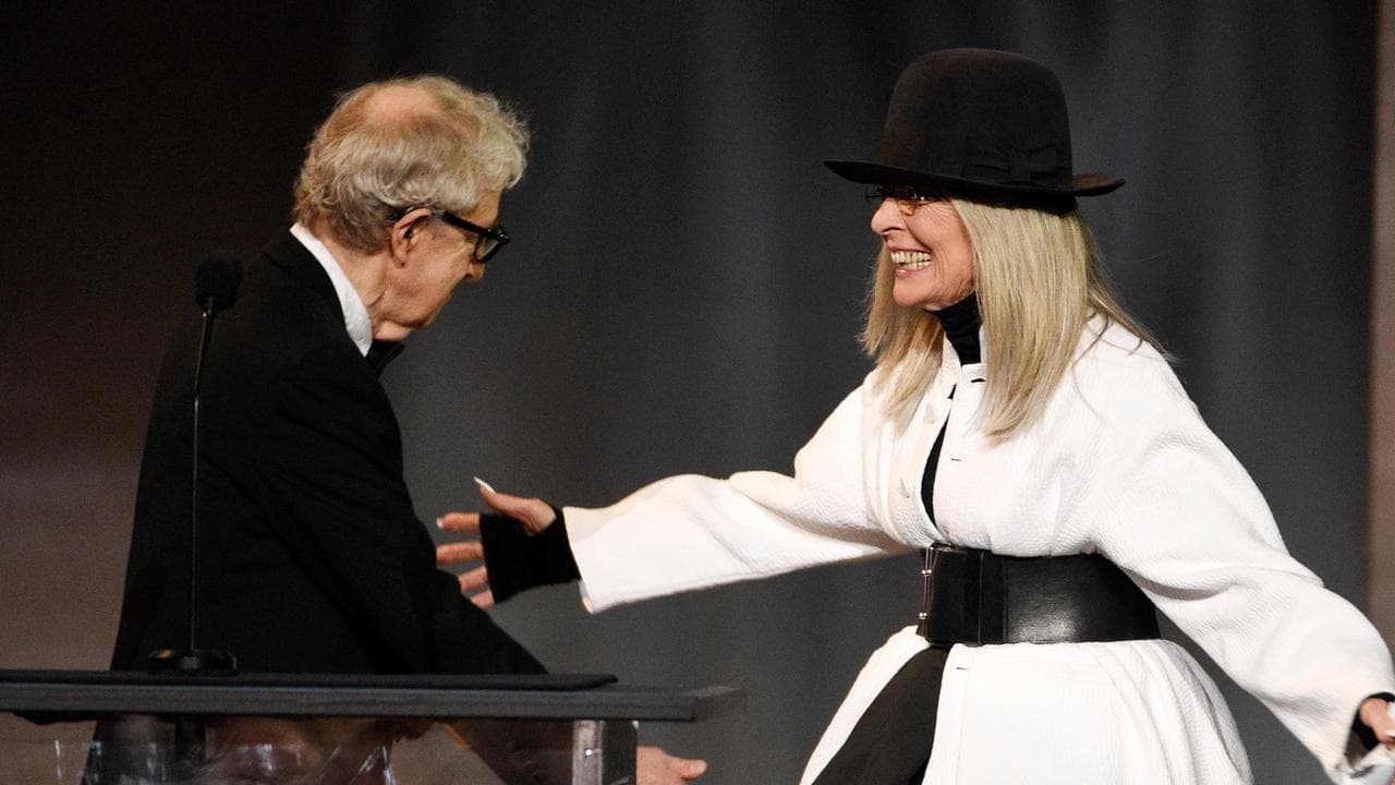 Filmmaker Woody Allen, left, greets actress Diane Keaton
