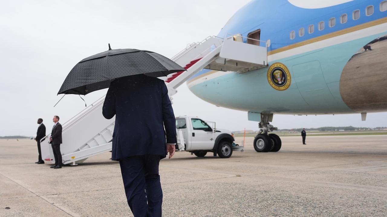 President Donald Trump walks to board Air Force One