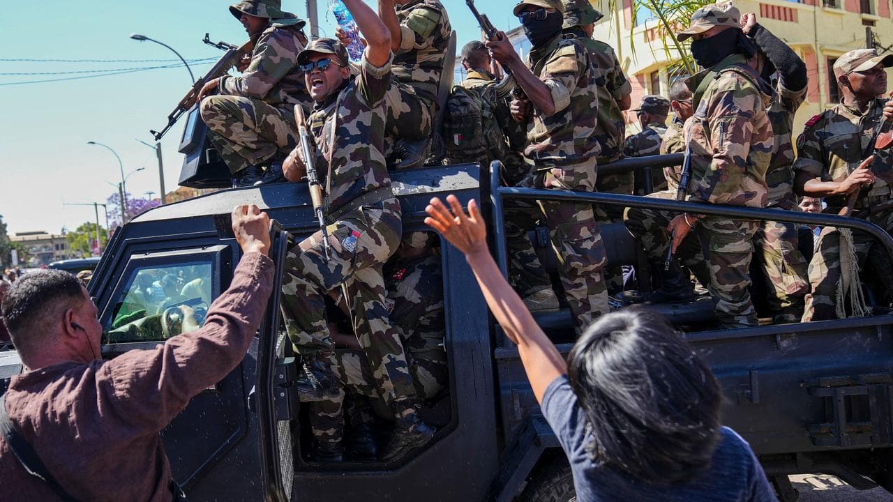 Soldiers are greeted by people 