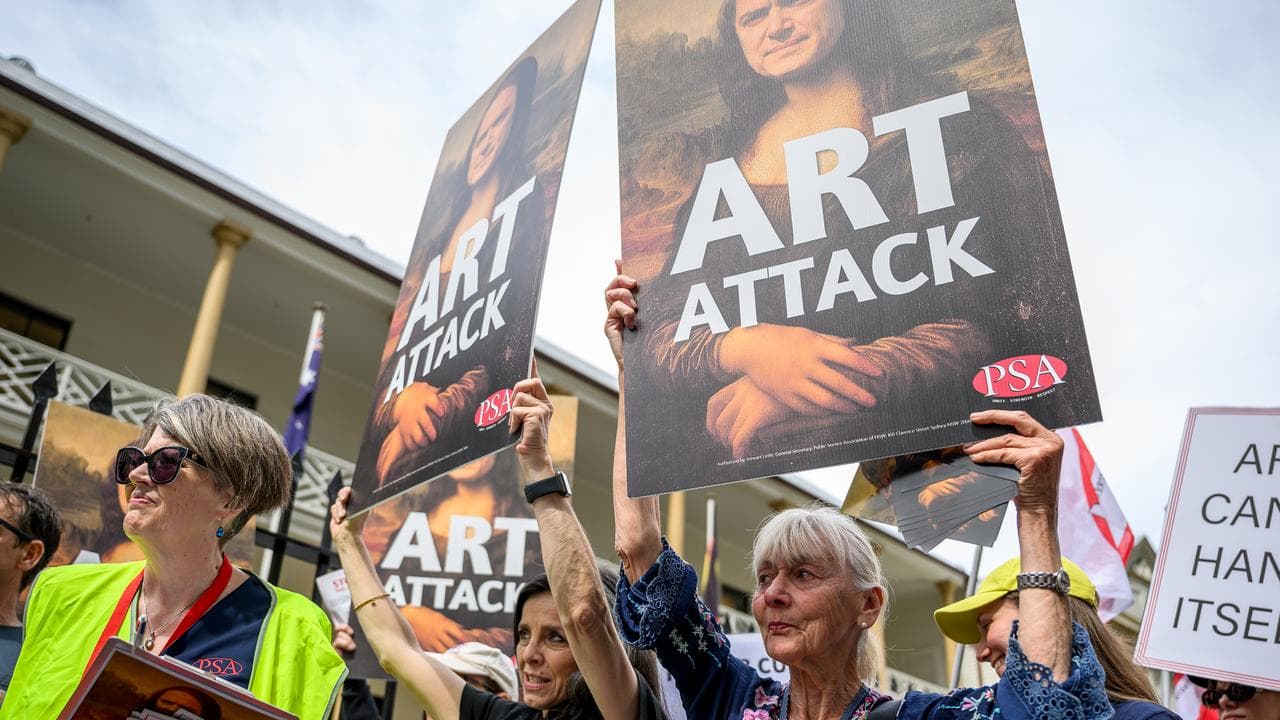 Placards depicting NSW Arts Minister John Graham as the Mona Lisa