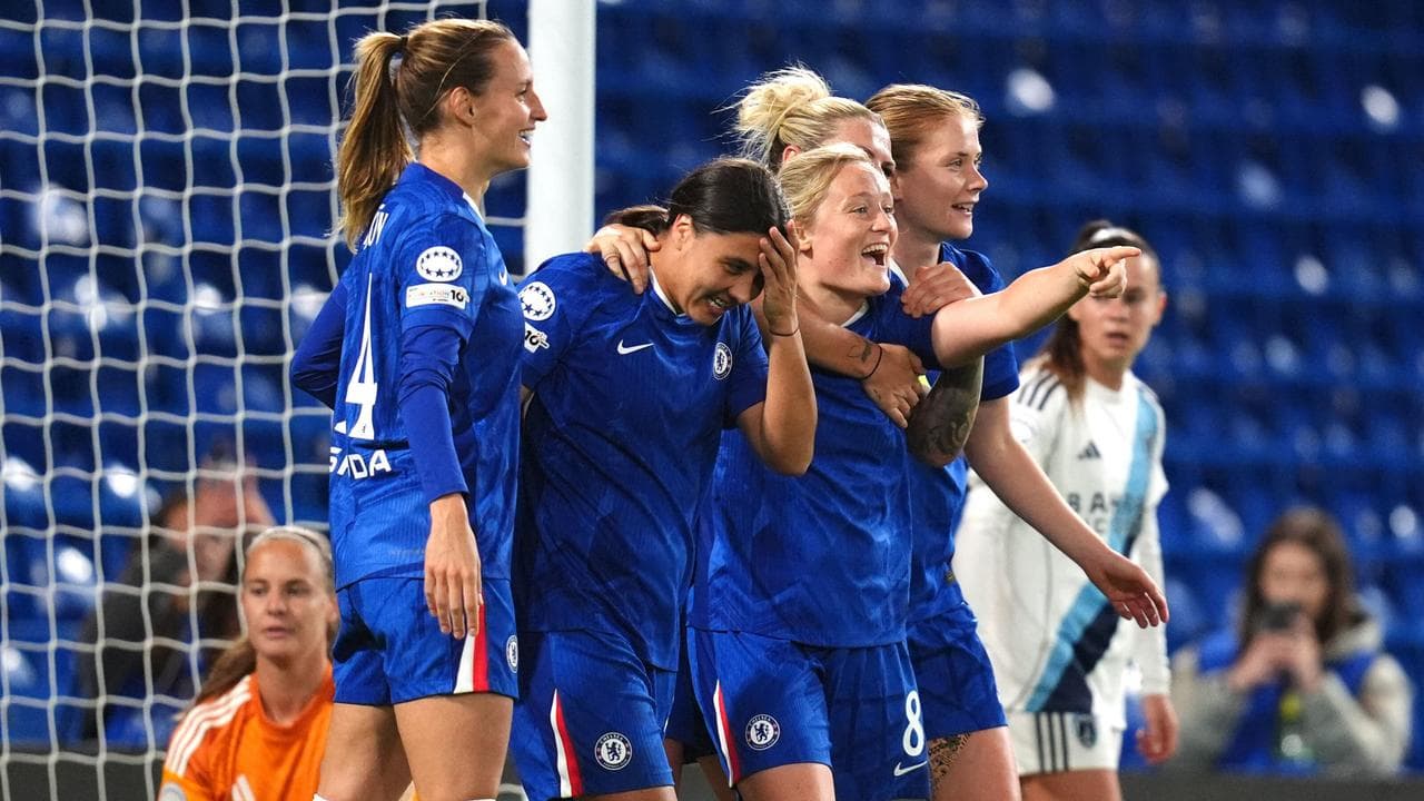 Sam Kerr celebrating with Chelsea teammates.