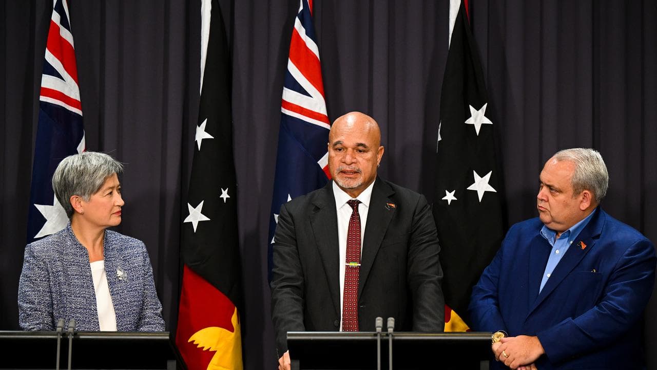 Penny Wong and PNG's John Rosso and Justin Tkatchenko