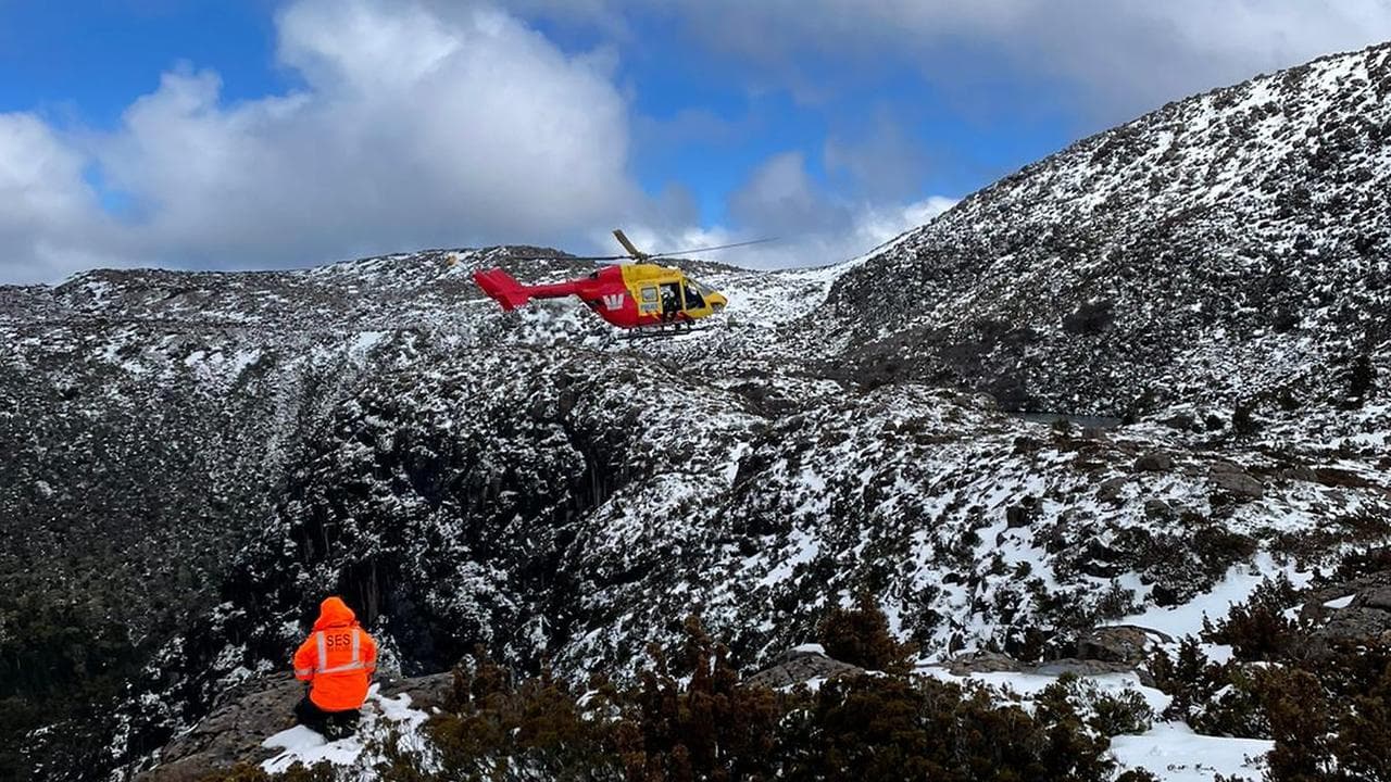 A rescue helicopter searches for a missing bushwalker