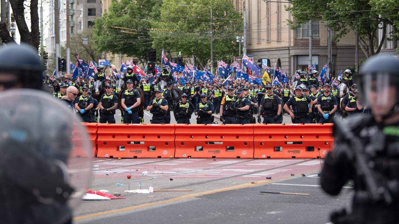 Riot police are seen during the March for Australia Rally.