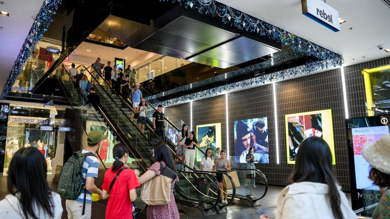 Shoppers are seen on Christmas Eve