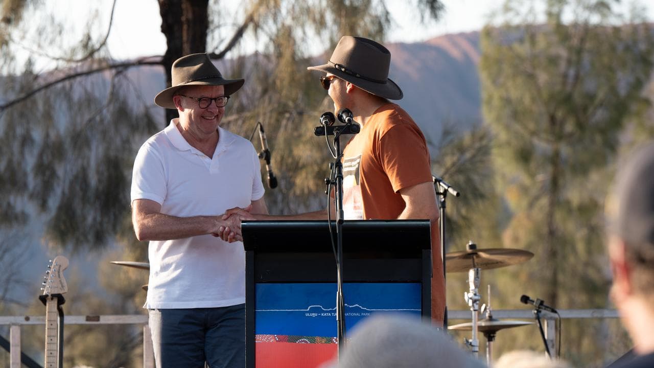 Prime Minister Anthony Albanese shakes a man's hand