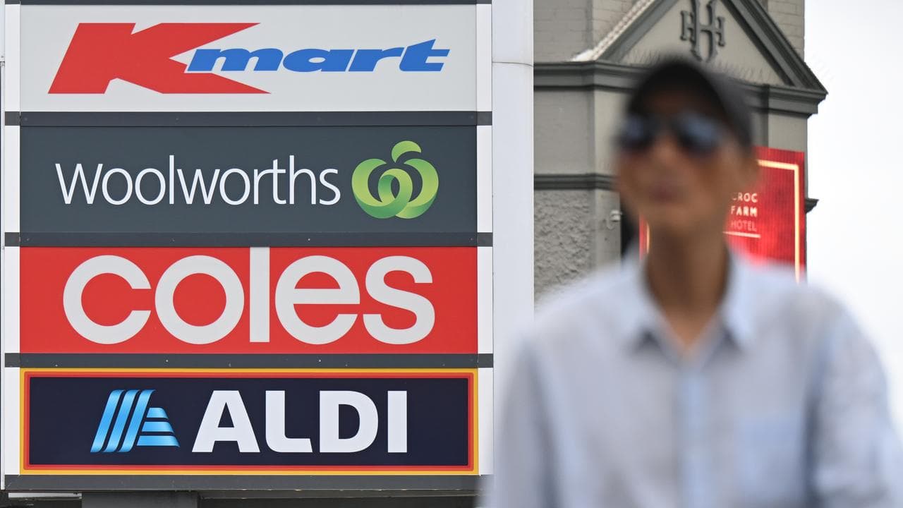 Signage for Woolworths, Coles and Aldi (file image)