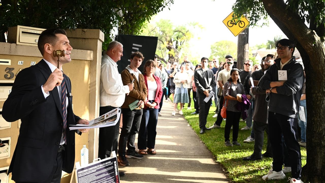 Auctioneer presides over a property auction in Homebush, Sydney