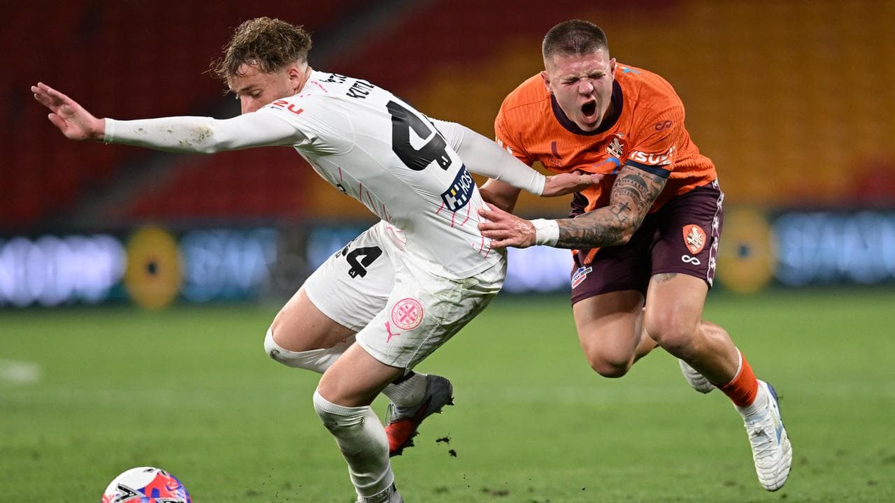 Melbourne City's Besian Kutleshi and Brisbane's Milorad Stajic.