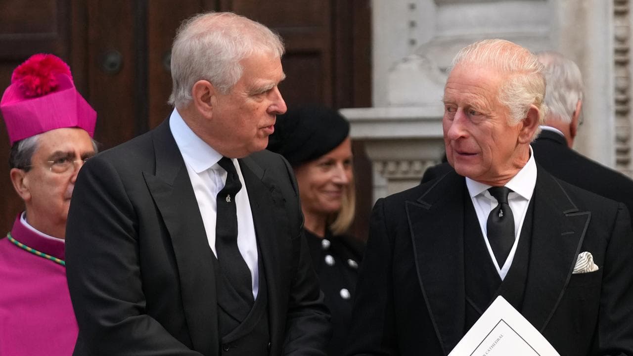 Former prince Andrew, left, and Britain's King Charles