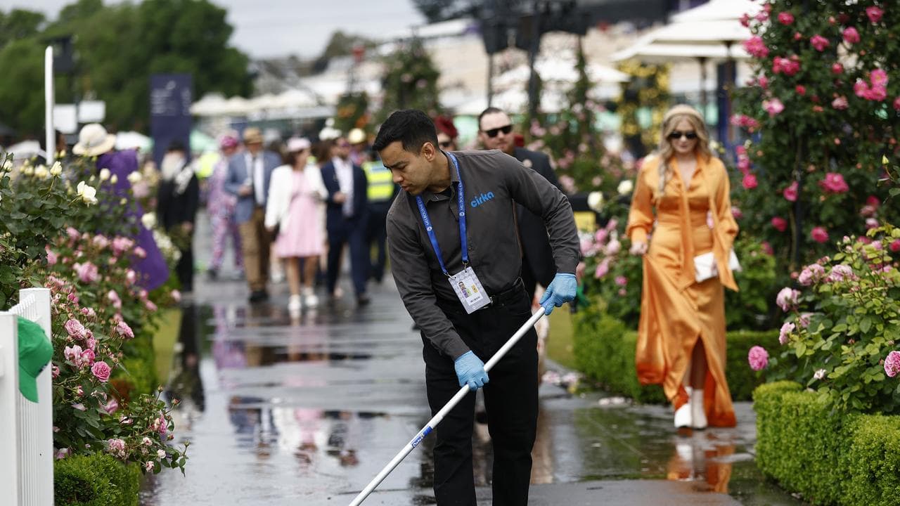 Rainwater is cleared at Flemington Racecourse