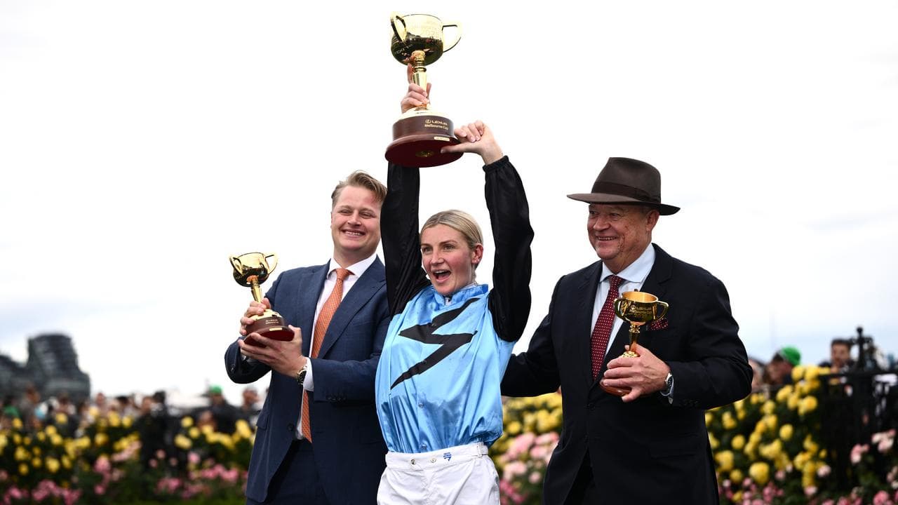 Trainers Calvin and Tony McEvoy celebrate with Jamie Melham.