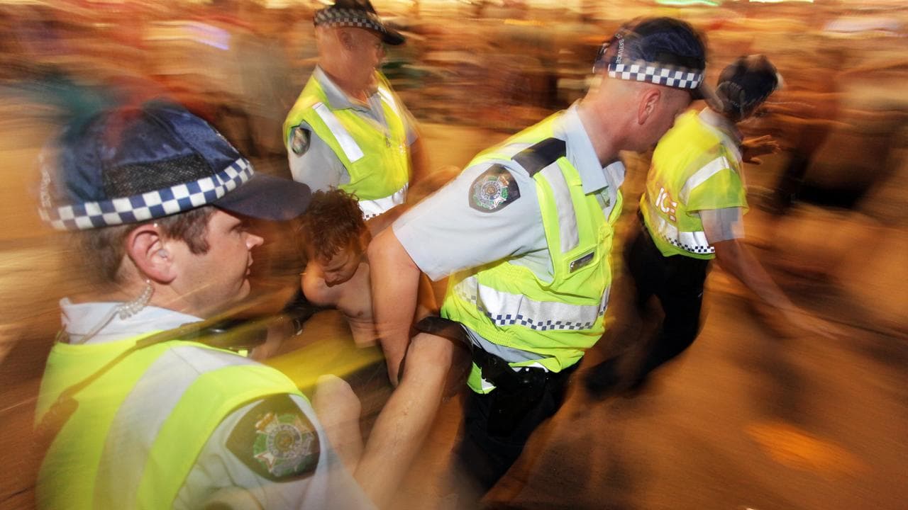 A boy being arrested at Schoolies week