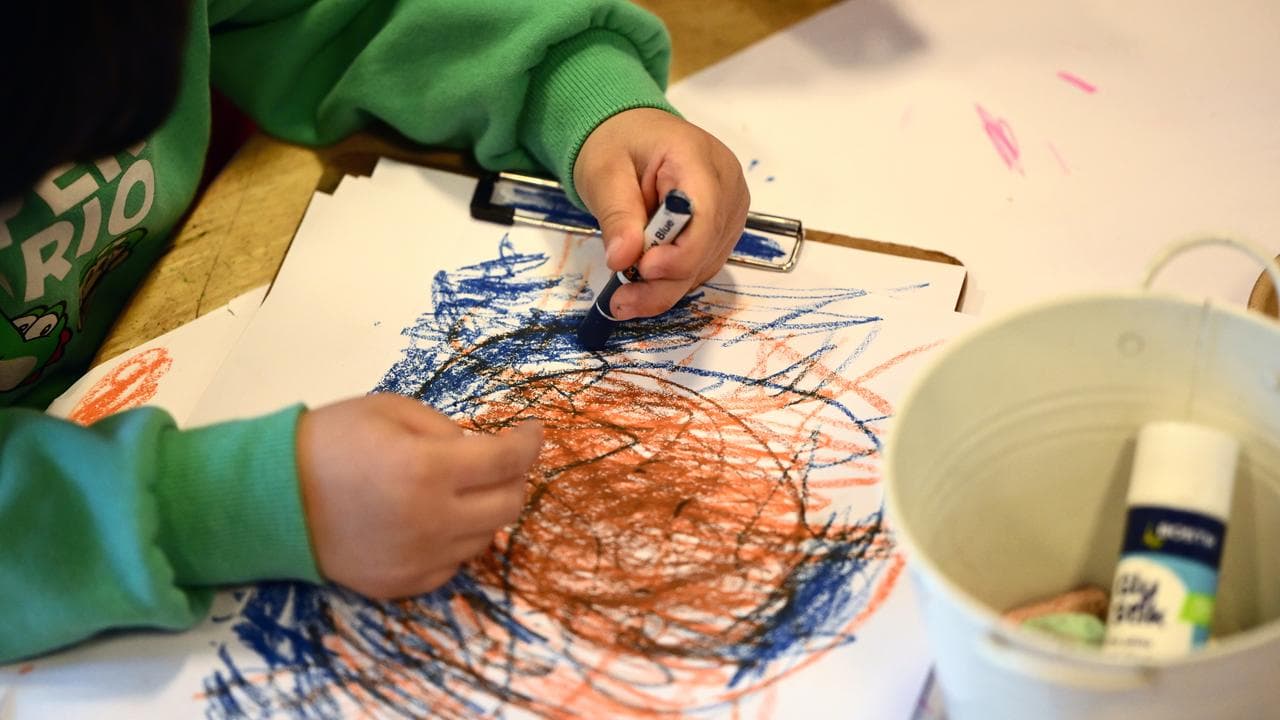 A child drawing at an early learning centre.