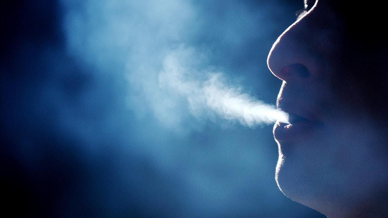 A person smoking a cigarette