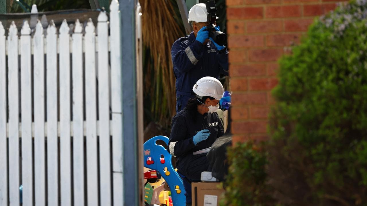 Forensic police at the scene of the house fire (file image)