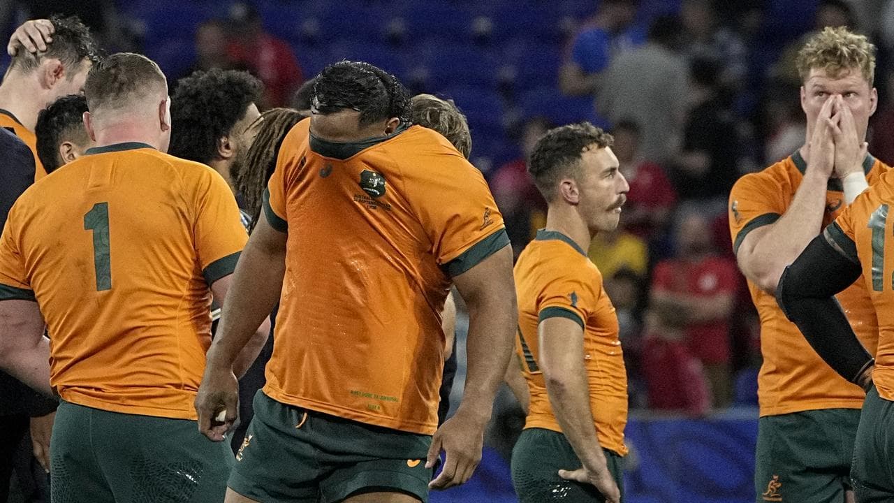 Australian players looking distraught.
